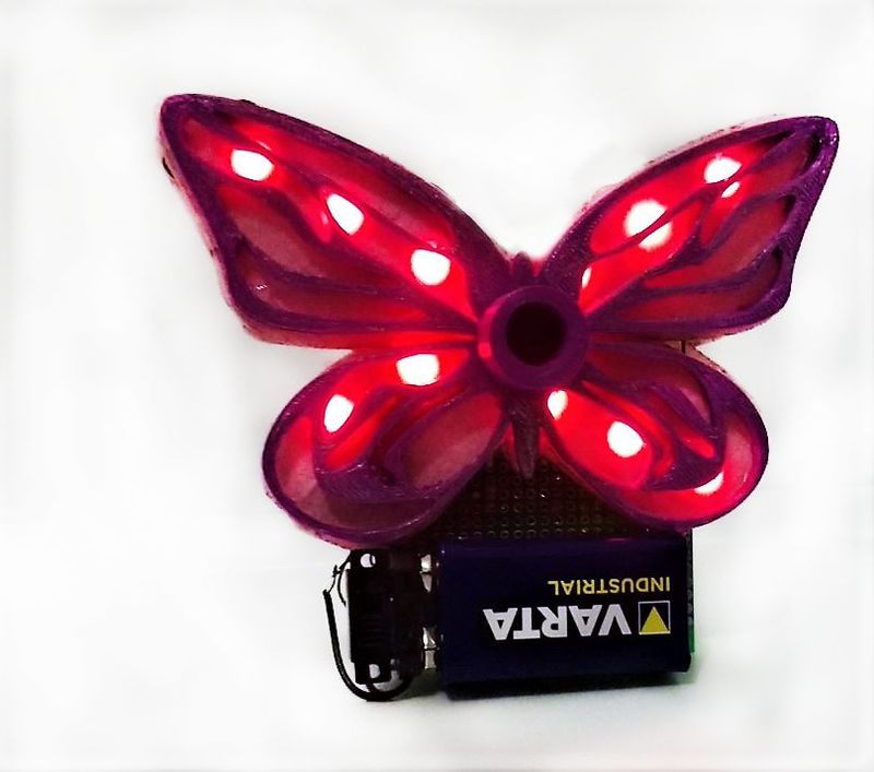 Glowing LED Butterfly FQW0YDBK437EPLB.LARGE.jpg