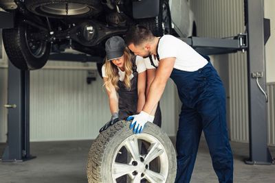 The_Ultimate_Guide_to_Car_Wheel_Alignment-_Why_It_Matters_and_How_to_Get_It_Right_auto-service-employees-pushing-wheel_23-2148327582.jpg